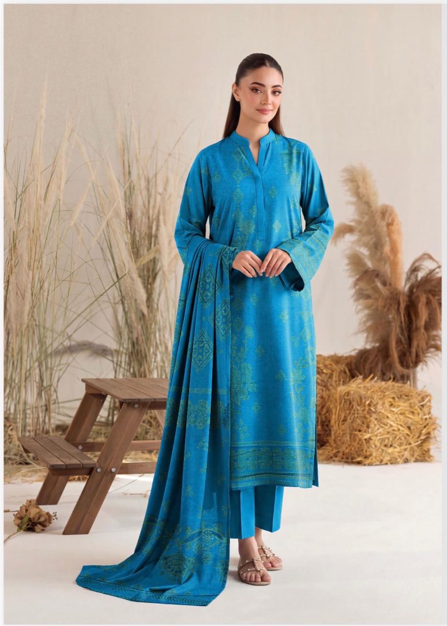Elegant teal blue printed women's winter 3-piece suit by Noreya Loom, featuring a stylish top, pants, and matching dupatta.