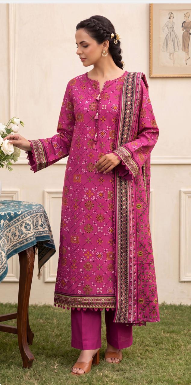 Magenta printed 3-piece suit by Noreya Loom, featuring intricate floral patterns and tailored fit, displayed on a hanger.