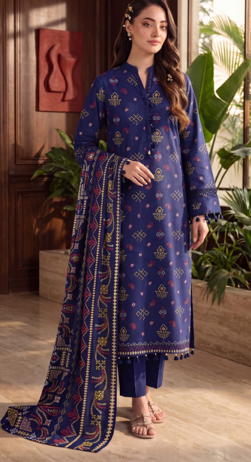 Royal blue printed 3-piece suit with embroidered border from Noreya Loom, featuring intricate design and elegant fabric details.