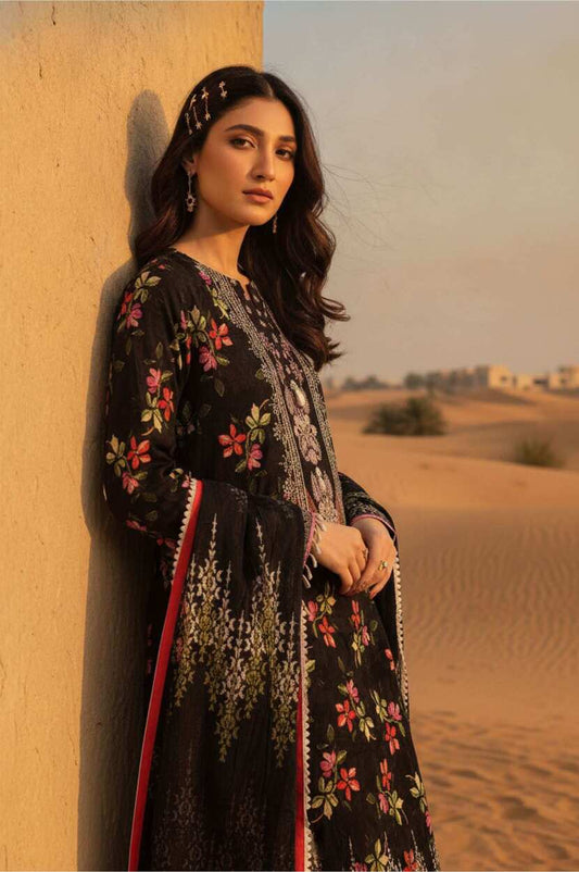 Black floral printed lawn 3-piece suit with matching dupatta and trousers, showcasing vibrant floral designs for traditional wear.