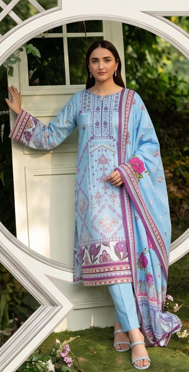Elegant sky blue 3-piece suit by Noreya Loom, featuring a tailored blazer, matching trousers, and a stylish shirt.