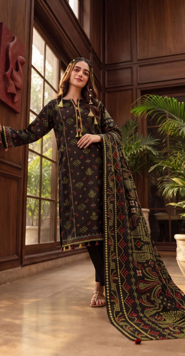 Black Bandhani print 3-piece winter suit by Noreya Loom, featuring a black winter kurta, matching dupatta, and churidar pants.