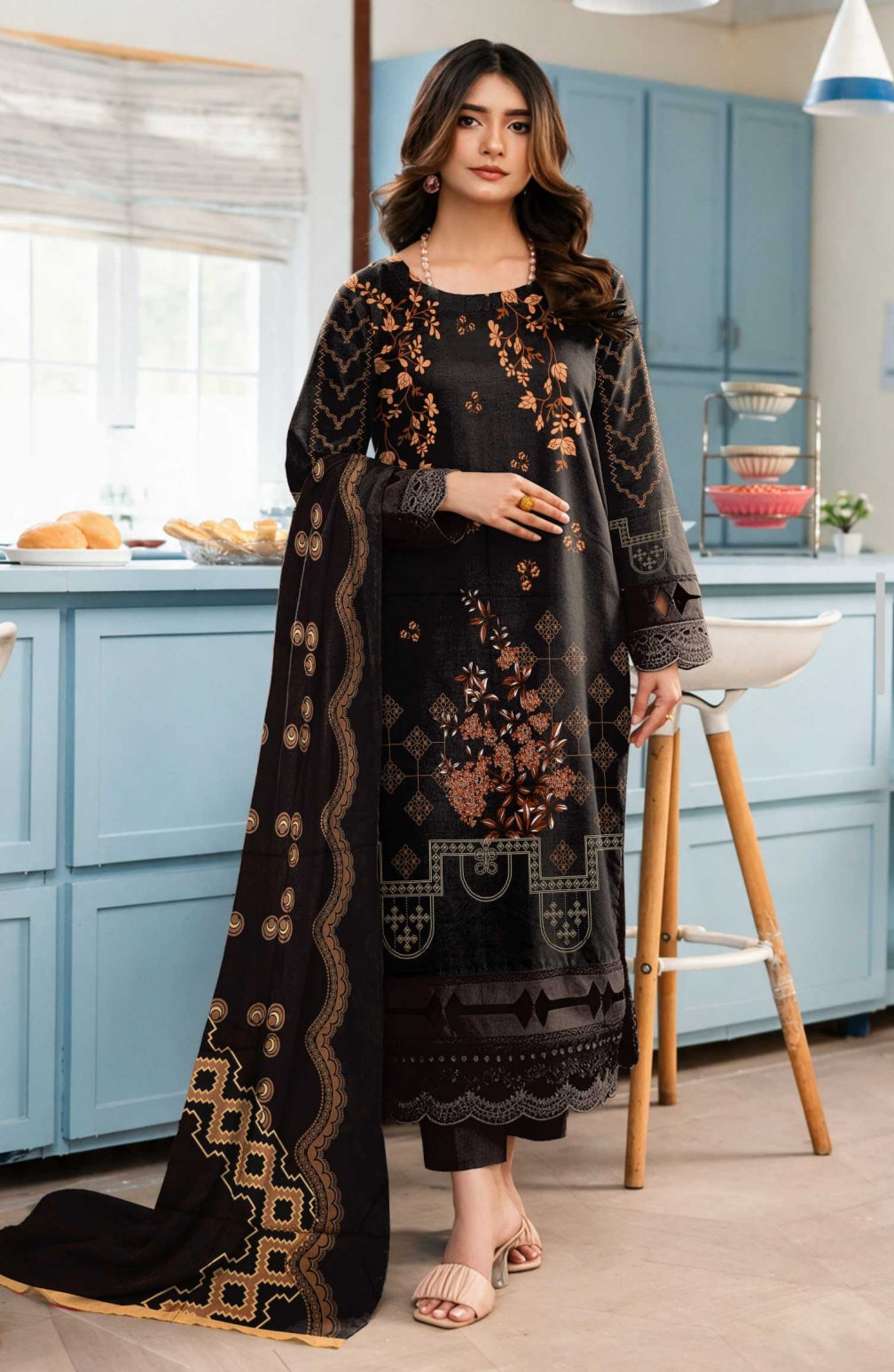 Black and rust floral printed winter 3-piece suit by Noreya Loom, featuring a coat, kurta, and matching trousers.