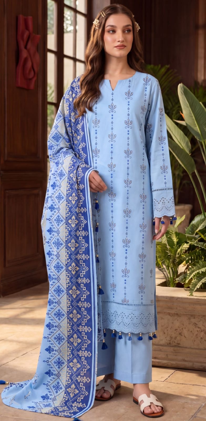 Elegant blue embroidered 3-piece lawn suit with printed dupatta by Noreya Loom, showcasing intricate embroidery and vibrant fabric.