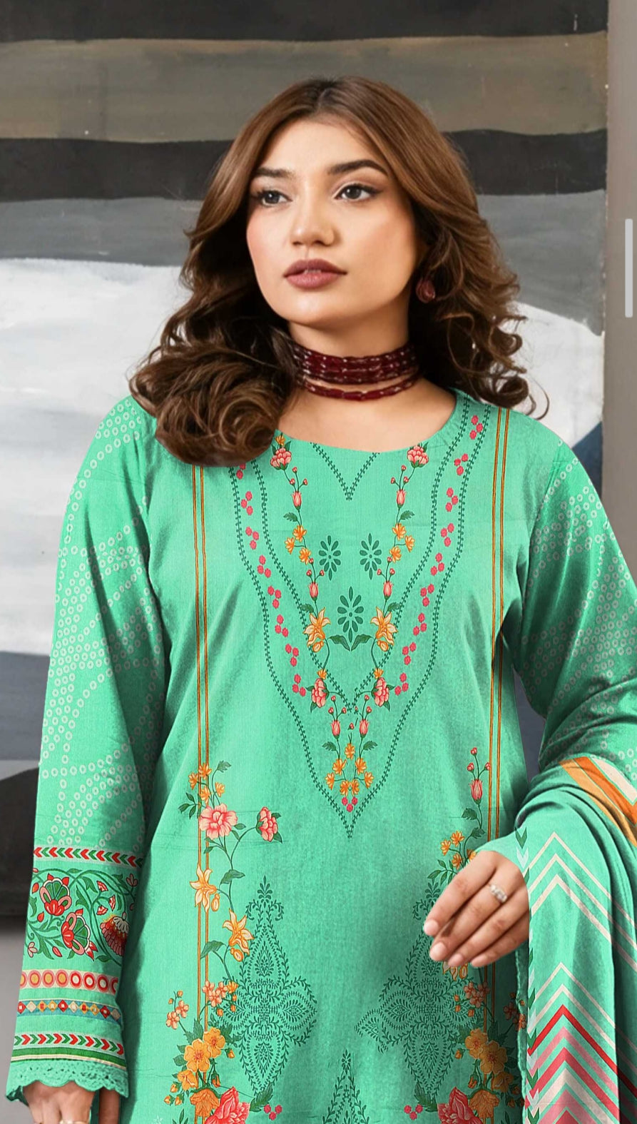 Premium mint green winter 3-piece embroidered lawn suit by Noreya Loom, featuring detailed embroidery and traditional design.