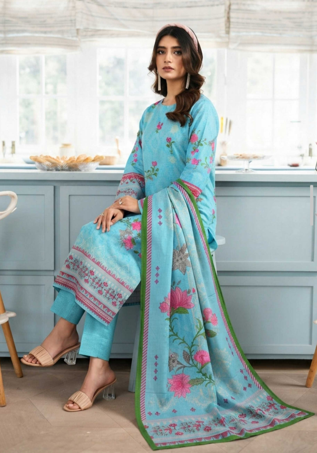 Sky blue floral printed winter 3-piece suit by Noreya Loom, featuring a stylish jacket, pants, and matching top.
