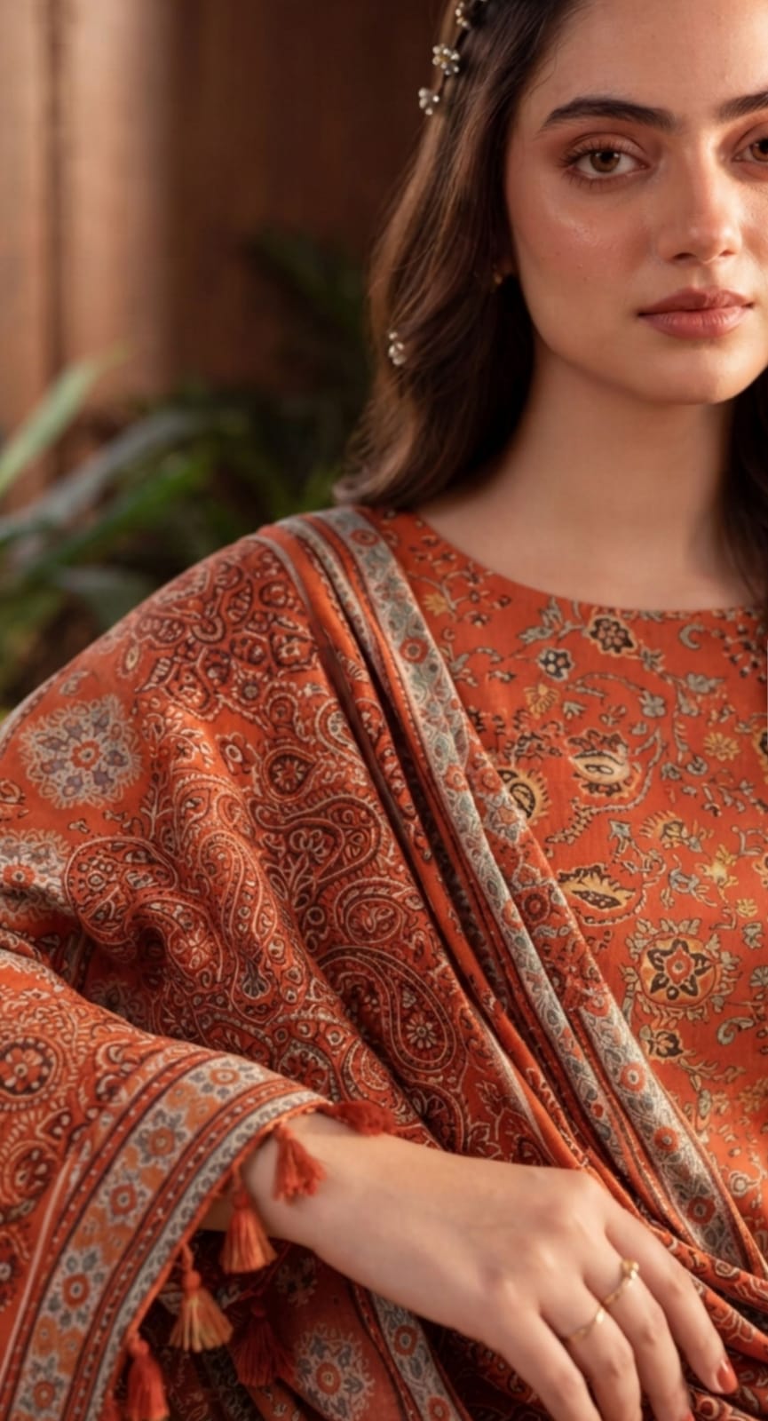 Rust orange winter 3-piece printed suit by Noreya Loom, featuring a tailored blazer, trousers, and matching top with intricate print details.