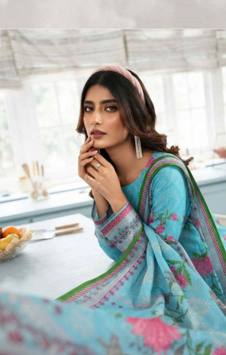 Noreya Loom premium sky blue floral winter 3-piece printed suit with matching top, pants, and jacket, showcasing elegant floral design.
