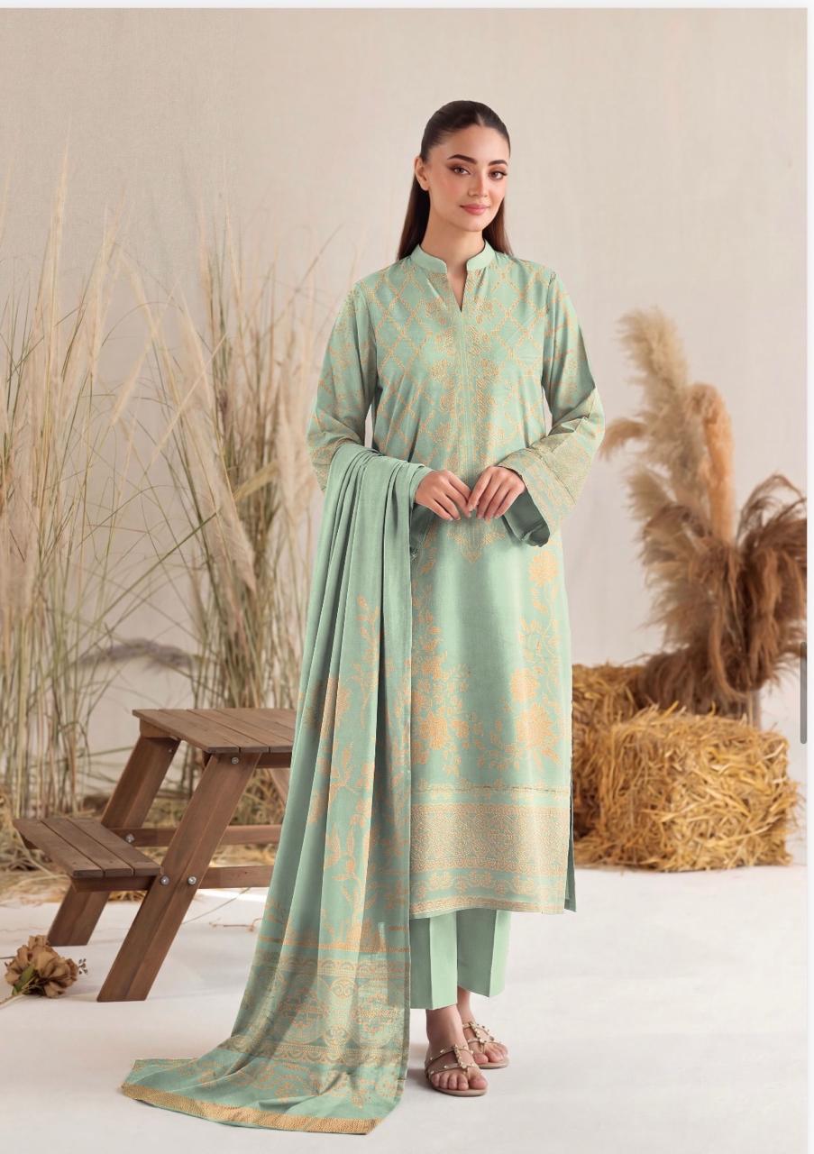 Mint green and gold printed women's winter 3-piece suit by Noreya Loom, featuring intricate patterns and comfortable fabric.