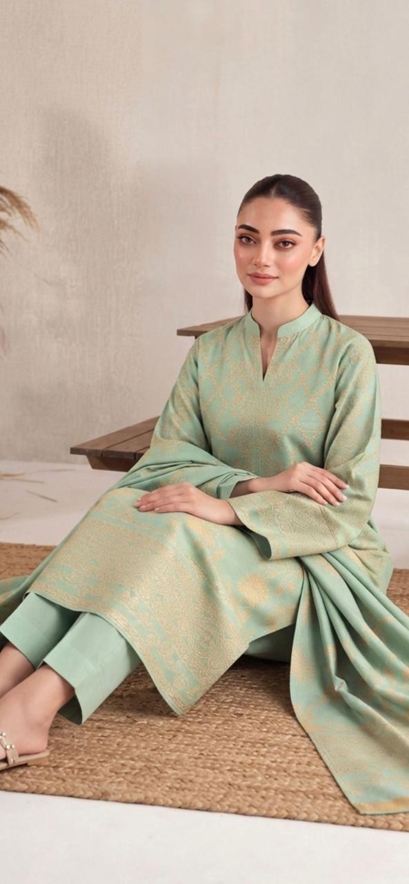 Mint green and gold printed women's winter 3-piece suit by Noreya Loom, featuring a stylish kurta, dupatta, and matching pants.