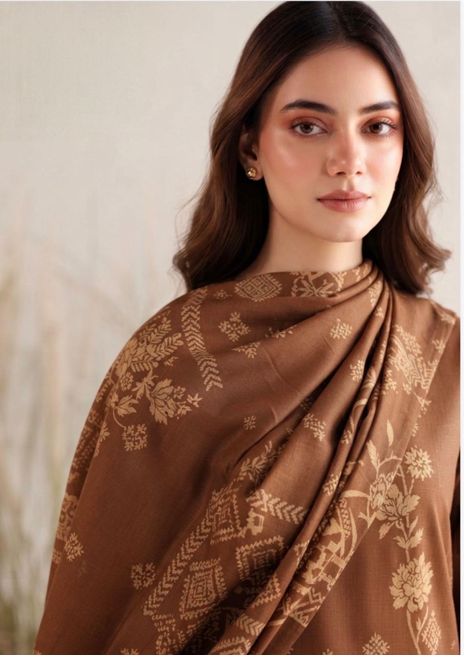 Noreya Loom women's winter 3-piece suit in chocolate brown with floral print, including a kurta, churidar, and dupatta, stylish and elegant.