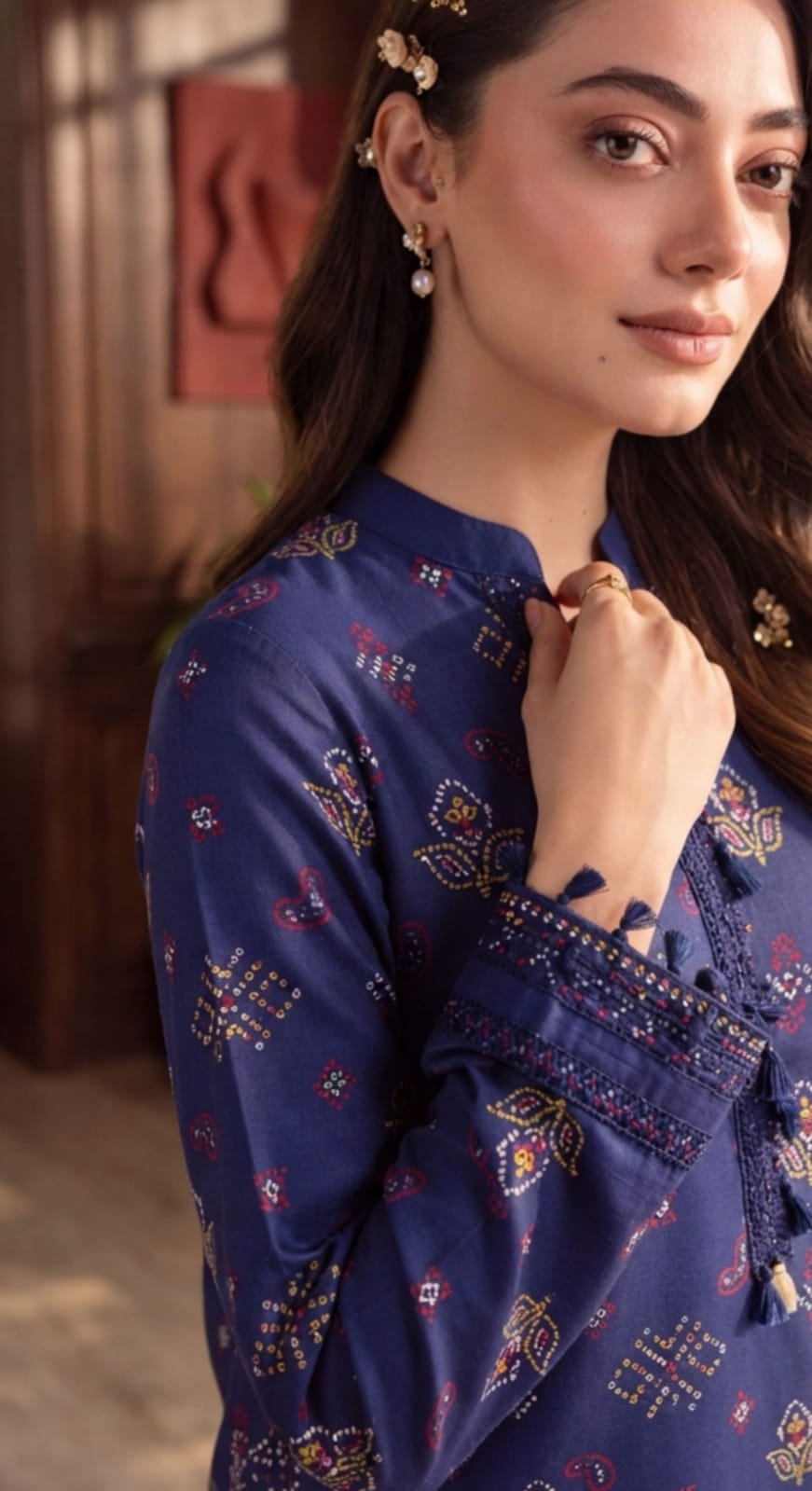 Royal blue printed 3-piece suit with embroidered border from Noreya Loom, featuring intricate floral patterns and classic tailoring.