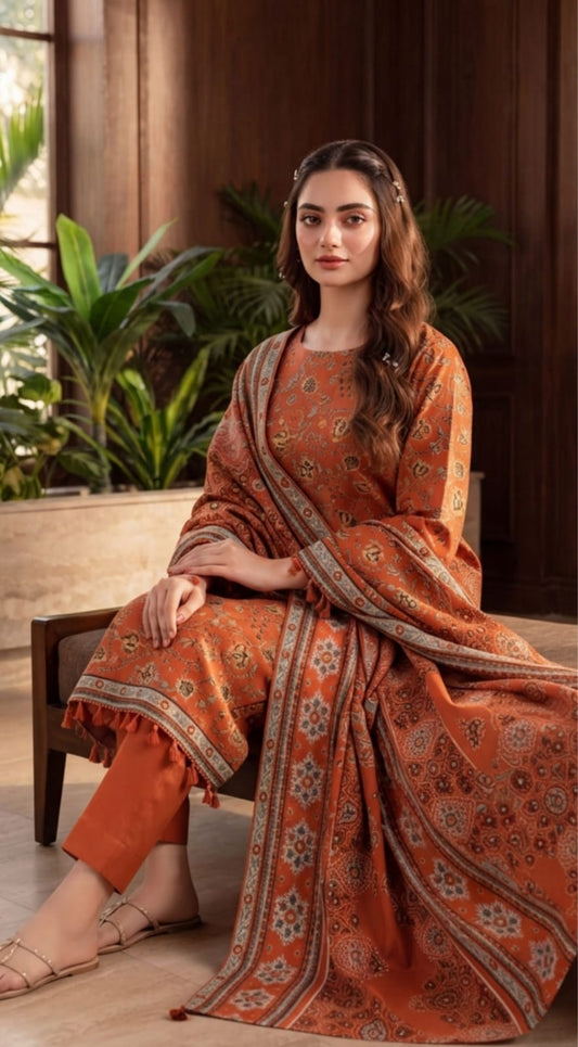 Rust orange winter 3-piece printed suit by Noreya Loom, featuring a stylish, coordinated ensemble with intricate patterns and warm fabric.