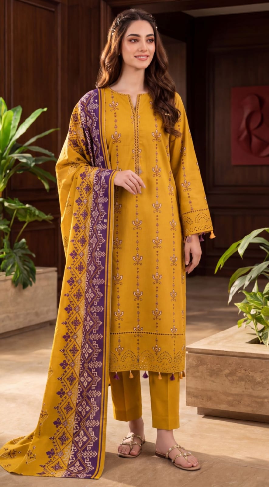 Noreya Loom Mustard Heritage Winter Collection printed 3-piece suit with traditional design and intricate patterns displayed in the image.
