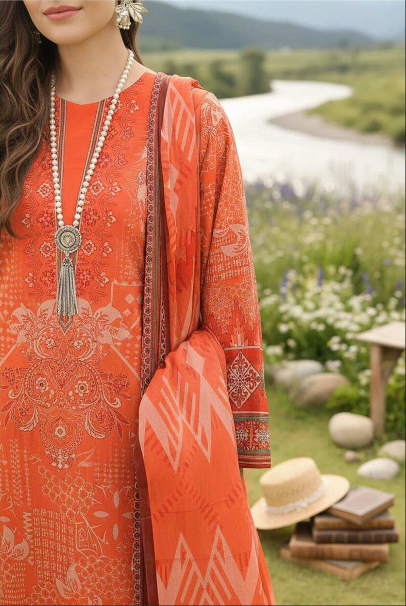 Coral orange printed 3-piece Pakistani lawn suit with intricate design, featuring a long shirt, trousers, and dupatta from My Store.