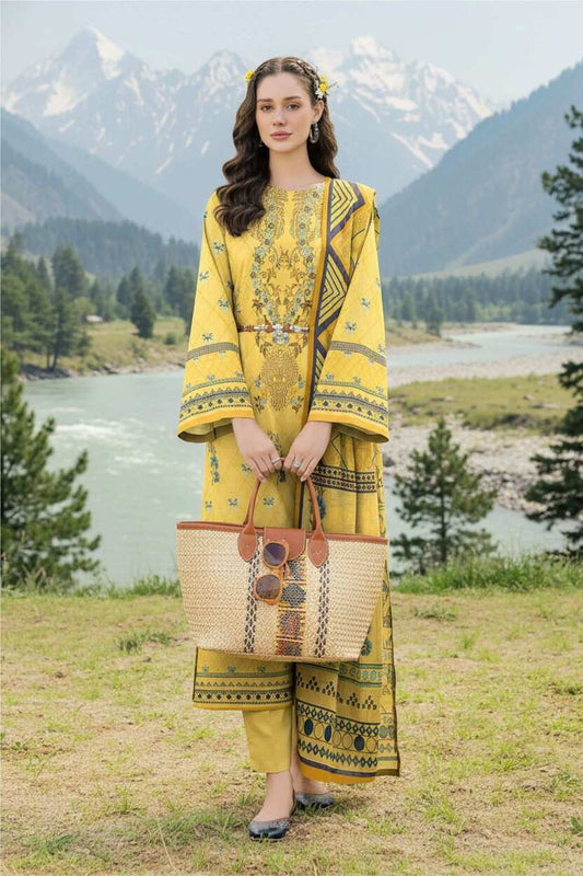 Mustard yellow printed 3-piece suit from Pakistani lawn collection, featuring intricate traditional patterns and elegant fabric.