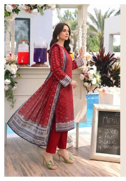 Elegant crimson red printed 3-piece lawn suit with statement dupatta, featuring intricate designs and traditional embroidery.