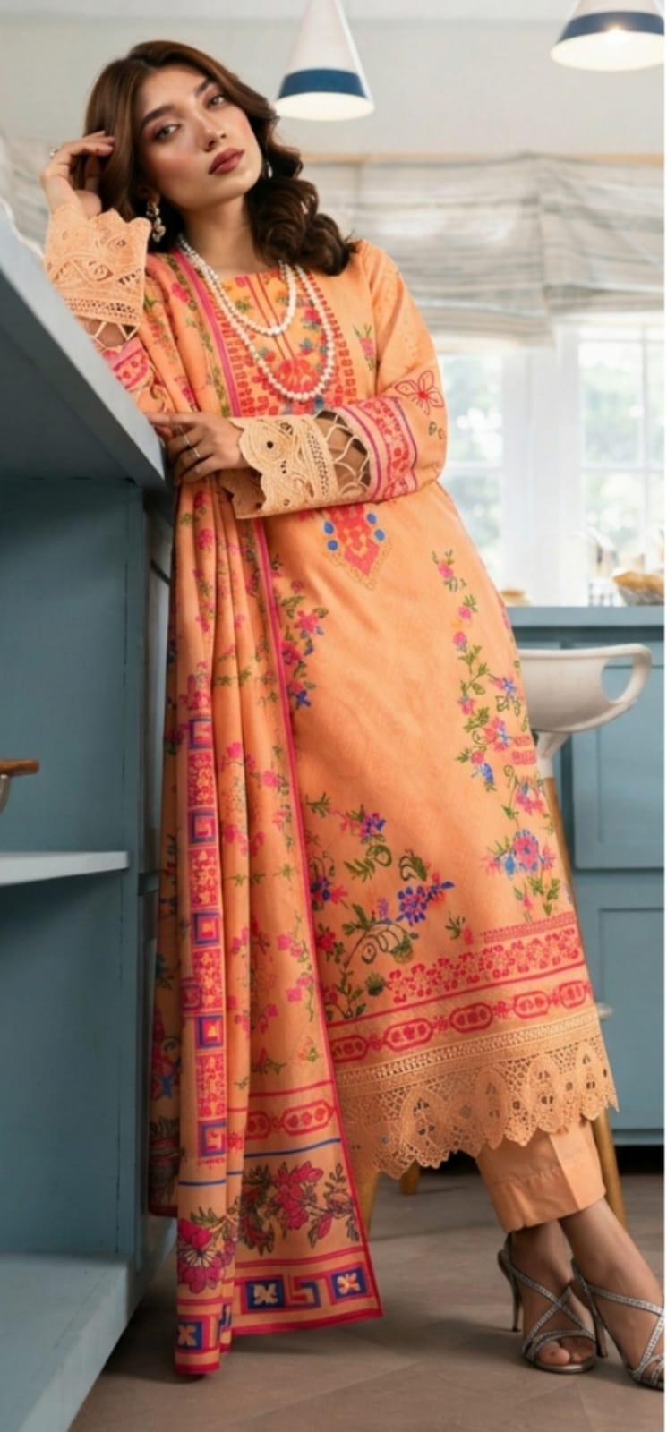 Peach floral printed 3-piece suit with designer dupatta by Noreya Loom, showcasing intricate floral patterns and elegant fabric details.