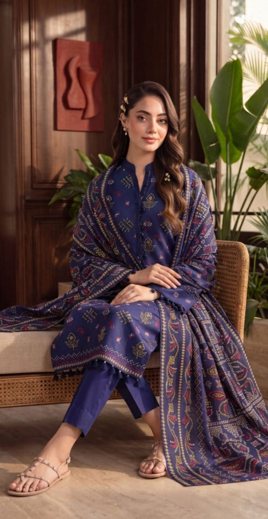 Royal blue printed 3-piece suit with embroidered border from Noreya Loom, showcasing detailed fabric and elegant design.
