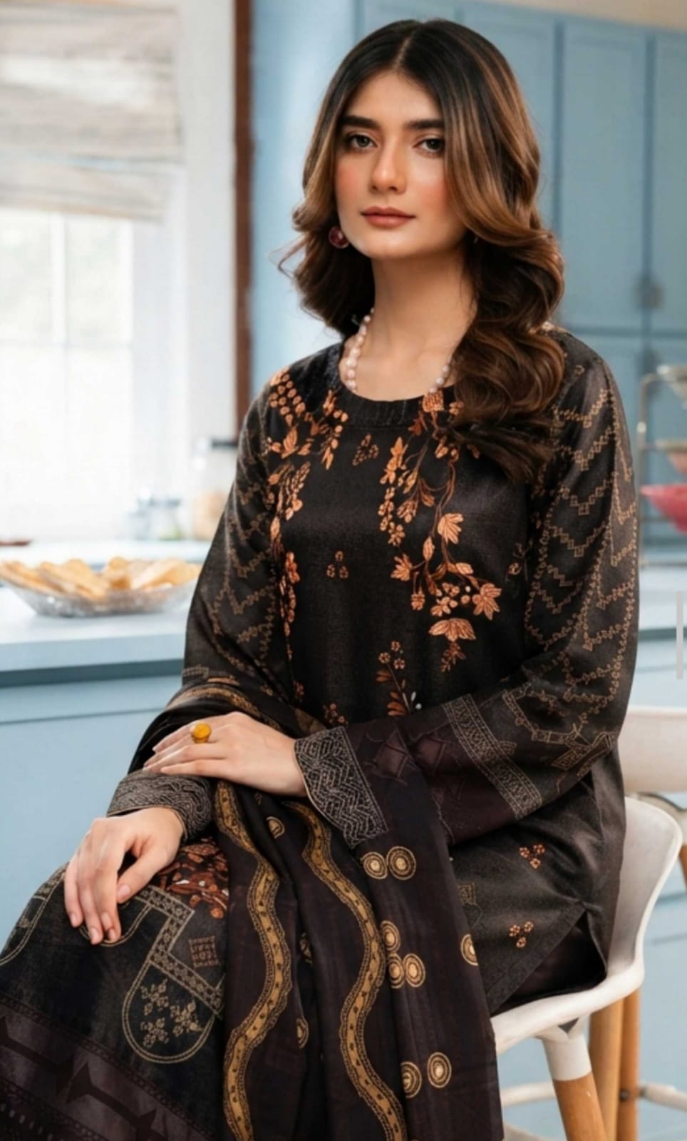 Noreya Loom black and rust floral printed winter 3-piece suit with a top, pants, and dupatta, featuring intricate floral patterns.