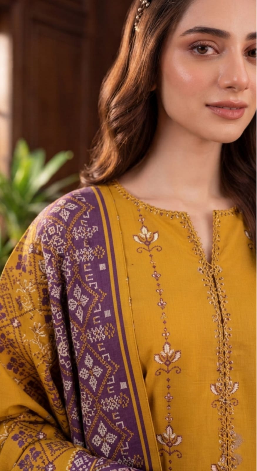 Noreya Loom Mustard Heritage Winter Collection printed 3-piece suit with traditional patterns and elegant design displayed on a mannequin.