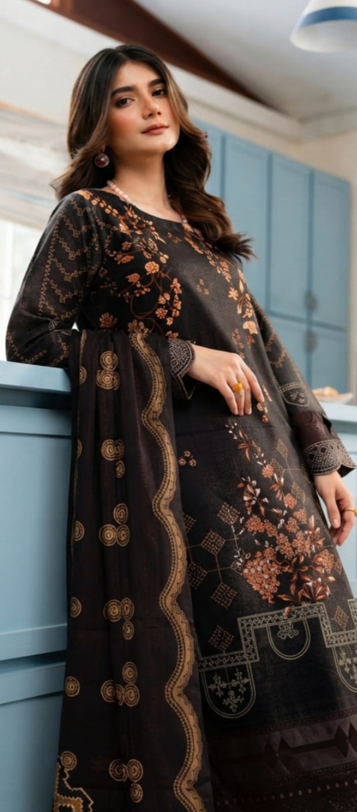 Noreya Loom black and rust floral printed winter 3-piece suit featuring a long sleeve top, matching pants, and a coordinating scarf.