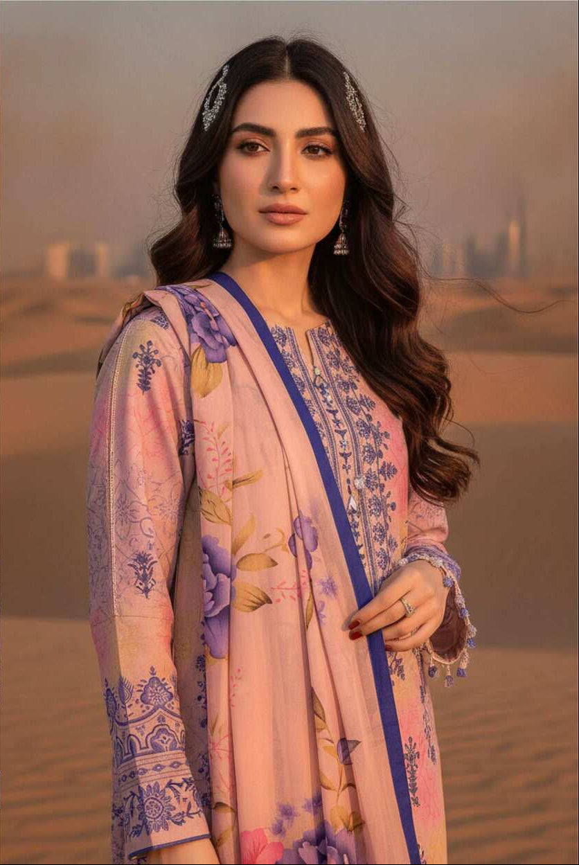 Pastel pink and lavender printed 3-piece lawn suit with floral designs, displayed on a hanger showcasing the fabric and pattern.
