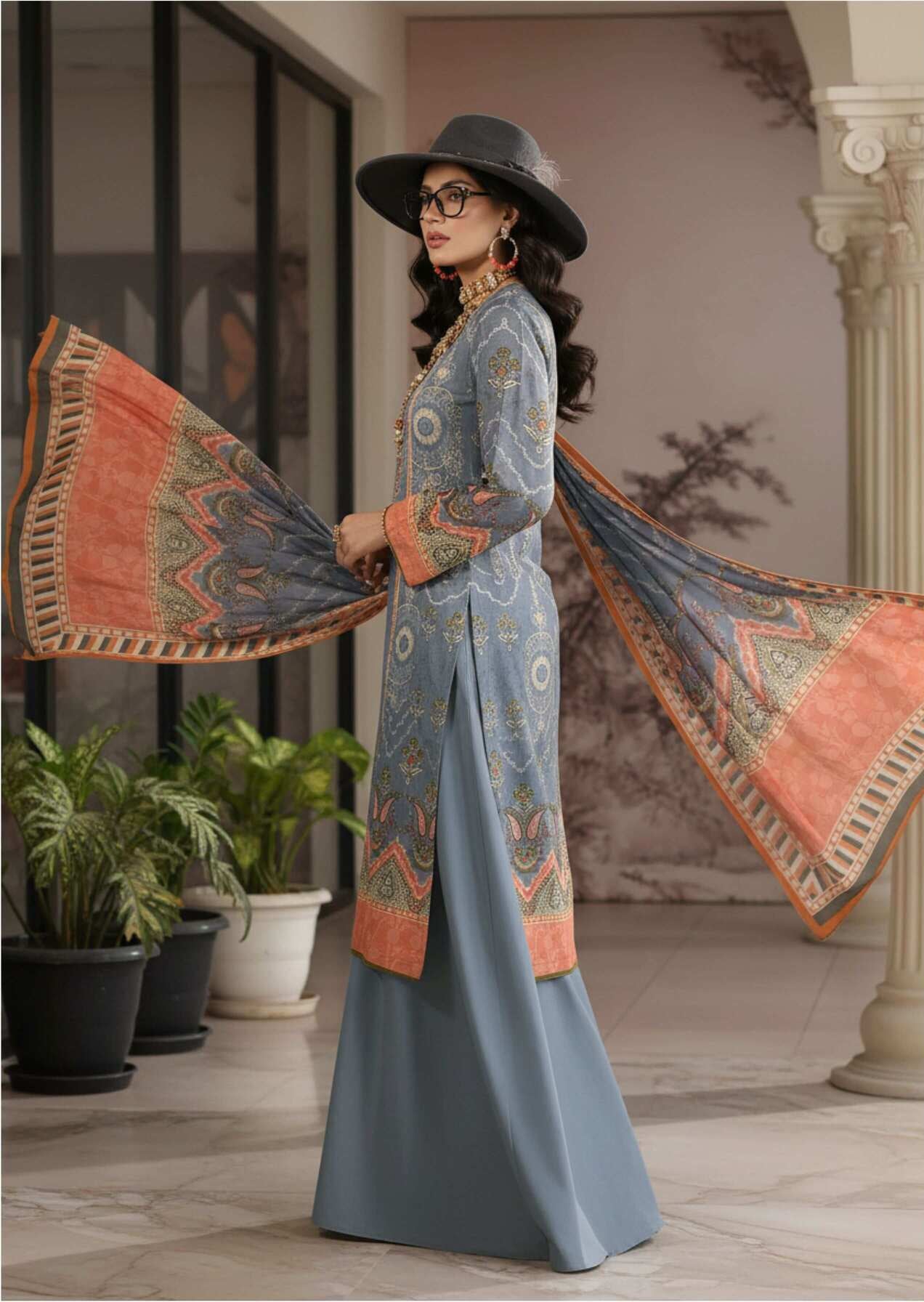 Elegant slate blue printed 3-piece Pakistani suit with intricate design, featuring a kurta, trousers, and dupatta in a premium collection