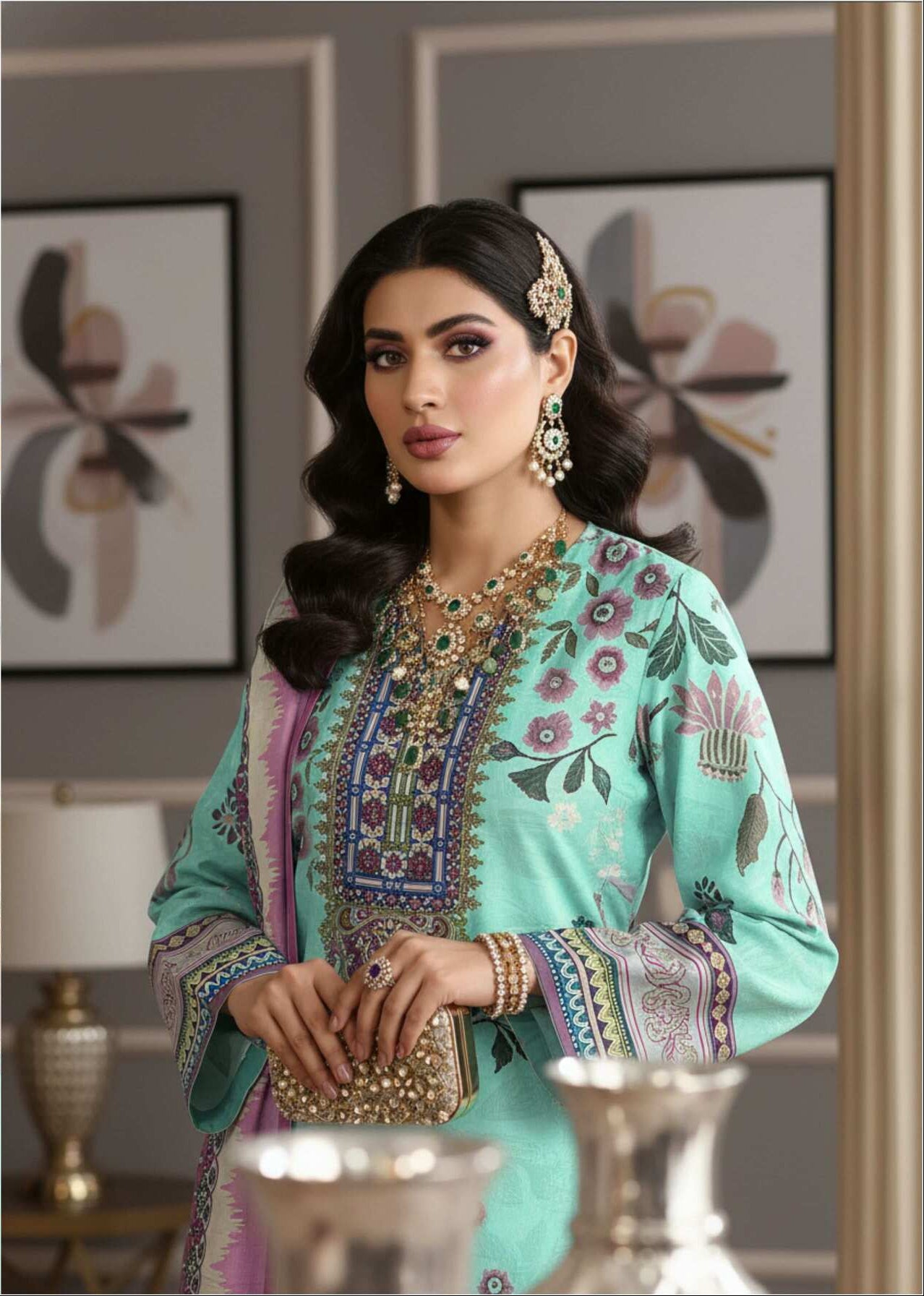 Elegant mint green printed 3-piece Pakistani suit with intricate designs, displayed on a mannequin.