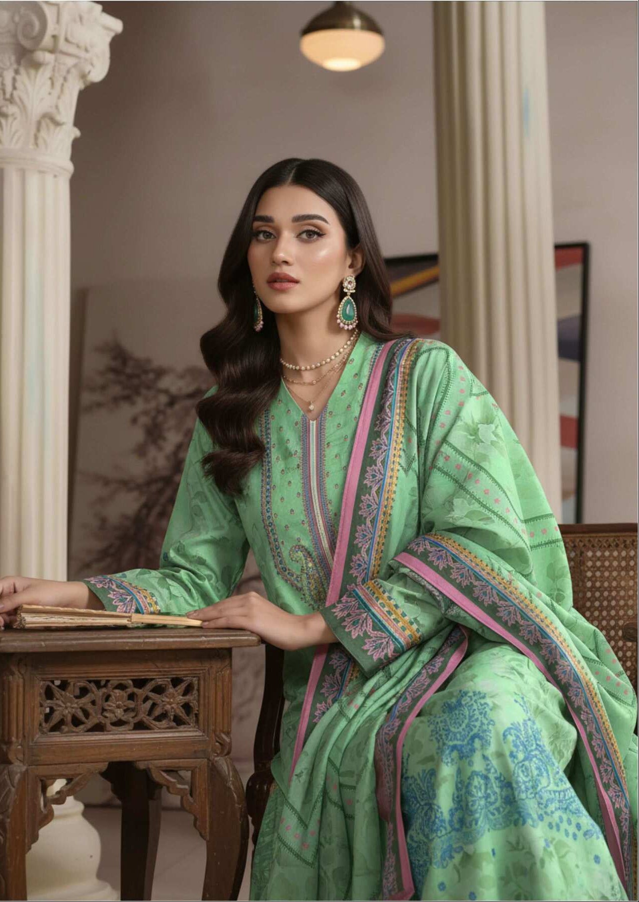 Elegant mint green printed 3-piece Pakistani suit with intricate design and matching dupatta, showcasing traditional craftsmanship.