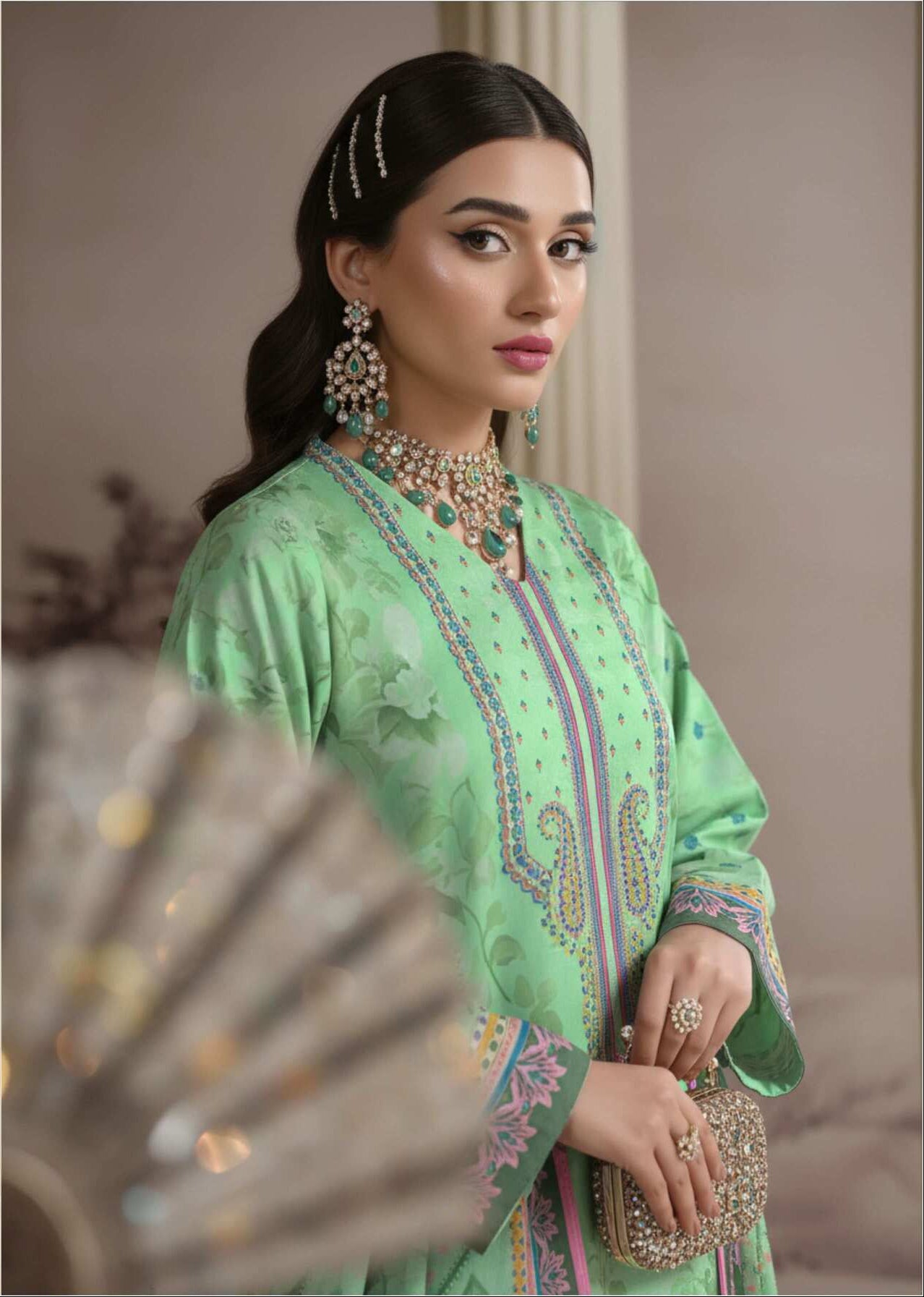 Mint green printed 3-piece Pakistani suit with intricate design, featuring a long kameez, matching trousers, and dupatta.