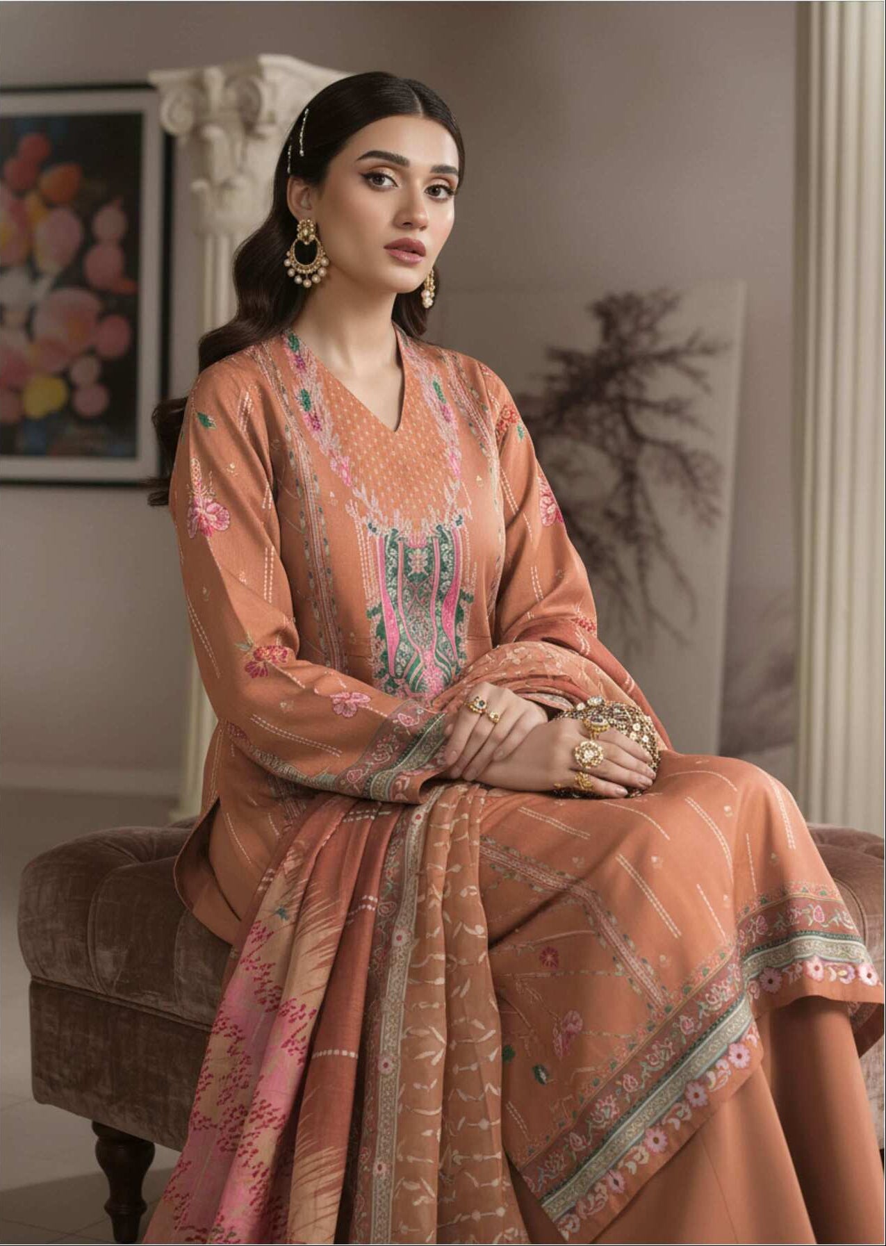 Elegant peach printed 3-piece Pakistani suit with intricate embroidery and matching dupatta, stylish traditional attire.