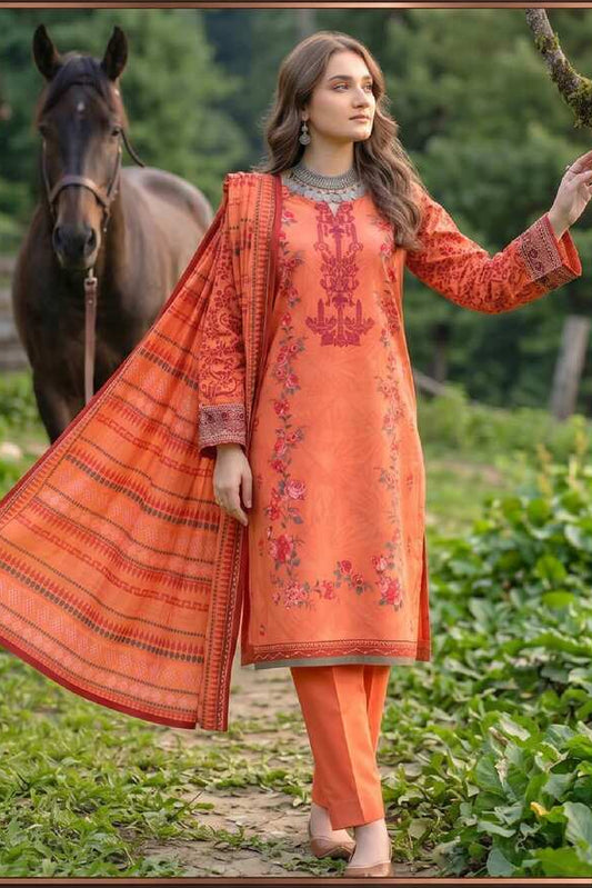 Coral orange printed 3-piece suit from Noor’s Heritage Collection, featuring traditional fabric and intricate design details.