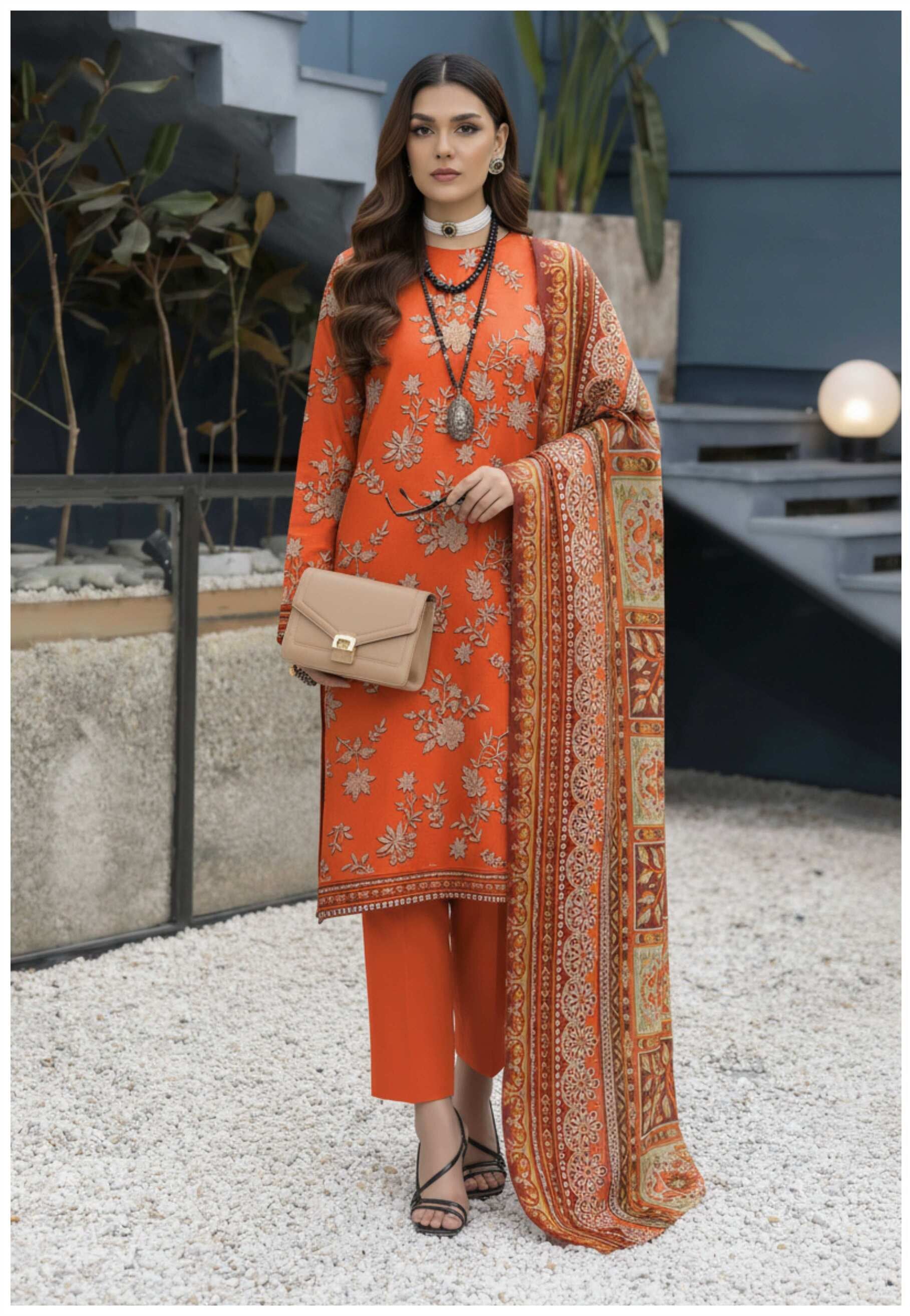 Rust orange embroidered luxury 3-piece suit with printed dupatta, featuring intricate embroidery and elegant fabric details.