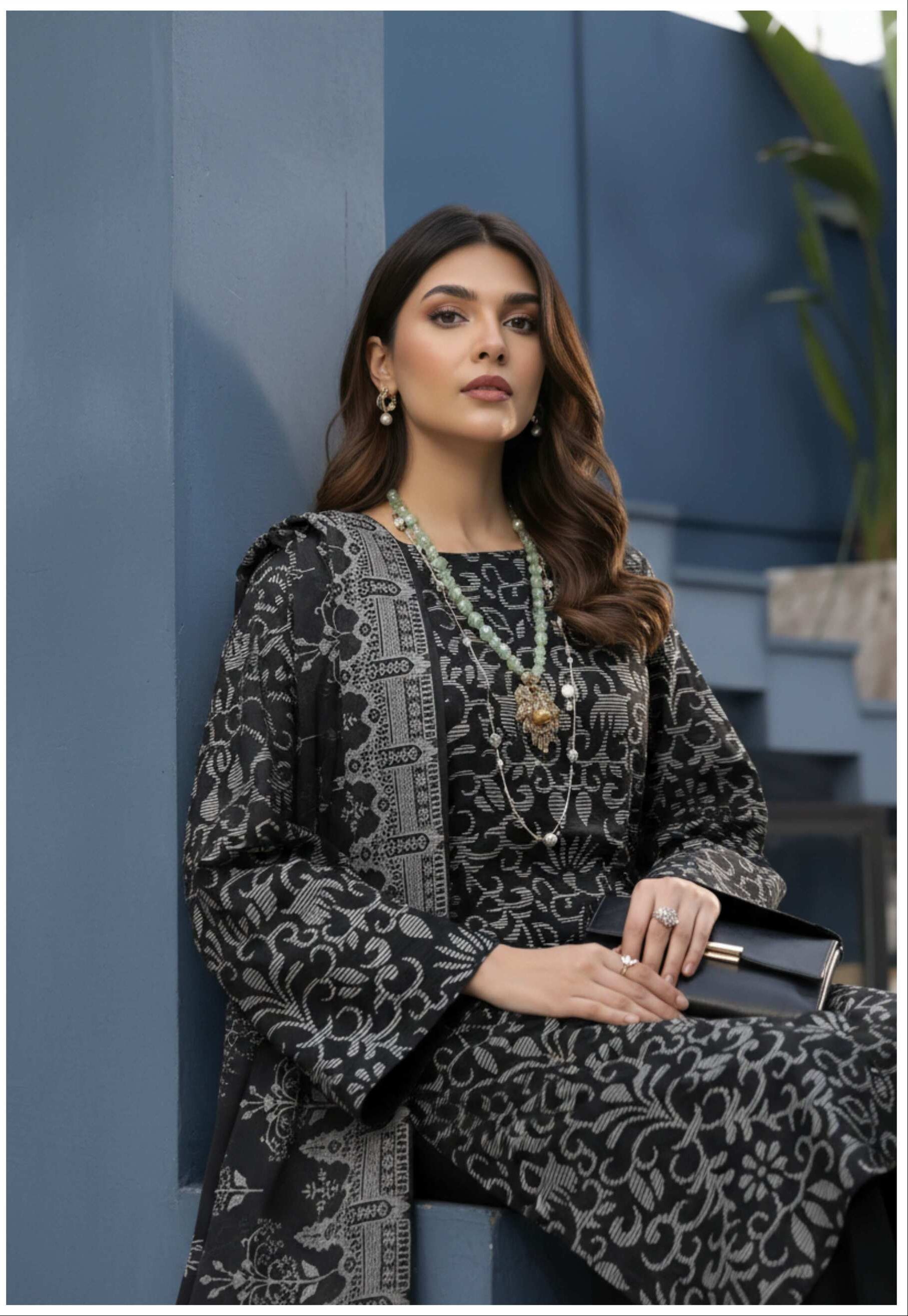 Elegant black and silver printed 3-piece Pakistani suit with intricate design, featuring a matching kurta, shalwar, and dupatta.