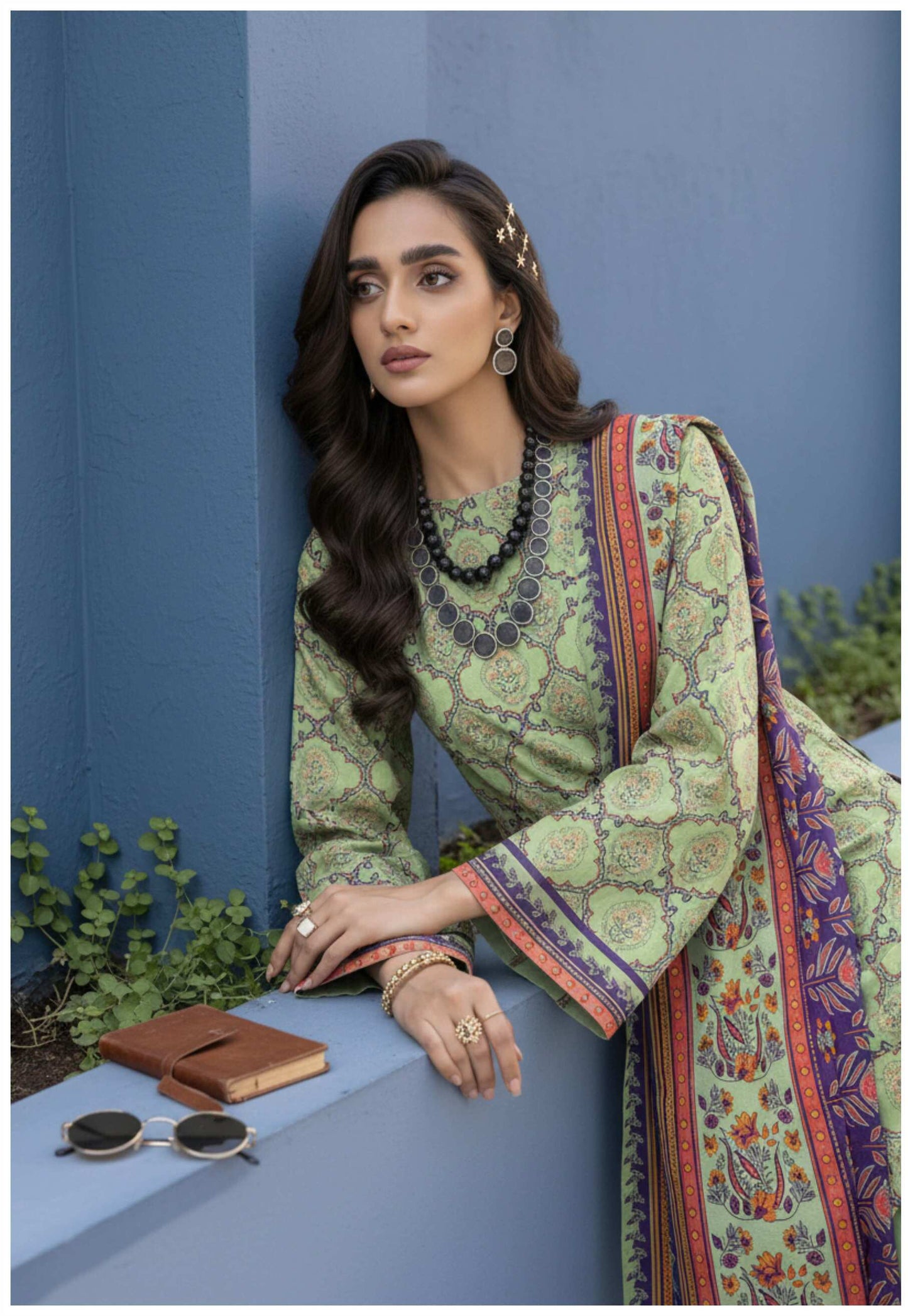 Elegant sage green printed 3-piece Pakistani suit with intricate designs, featuring a matching kameez, shalwar, and dupatta.