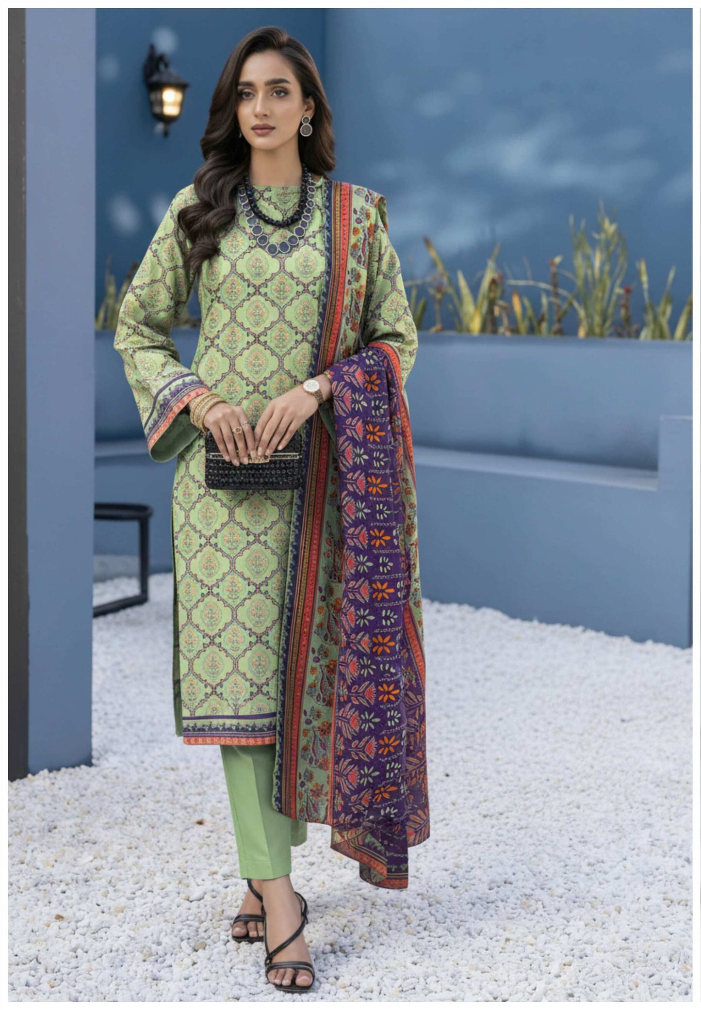 Elegant sage green printed 3-piece Pakistani suit with intricate designs, featuring a matching kurta, shalwar, and dupatta.