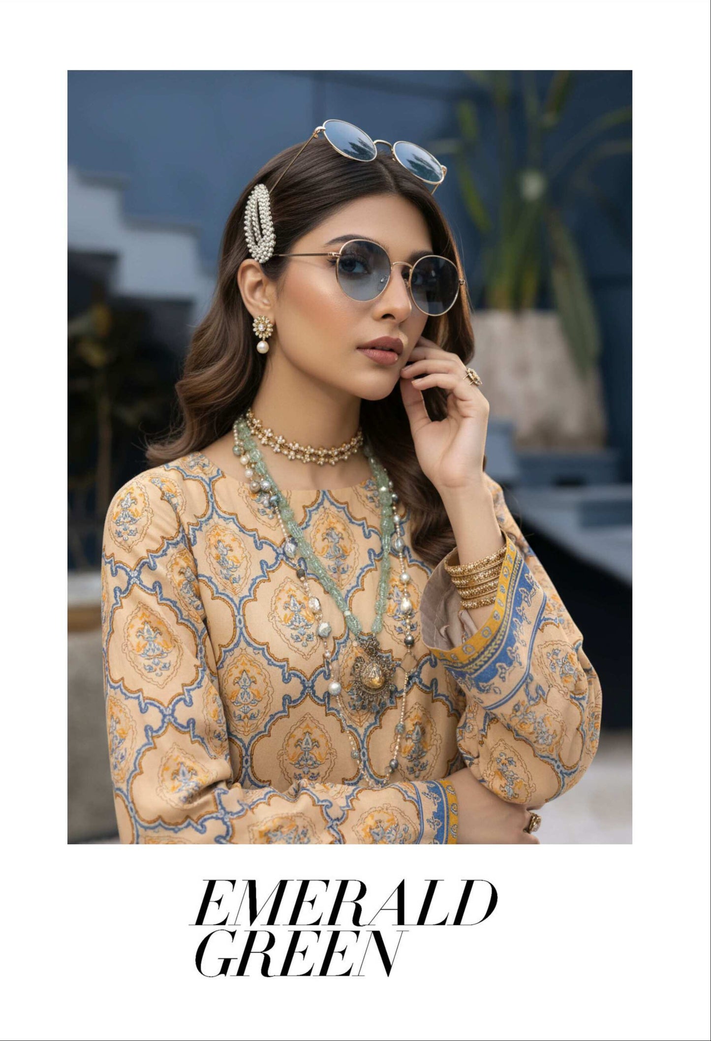 Elegant beige printed 3-piece lawn suit with matching blue printed dupatta, featuring intricate designs and lightweight fabric.