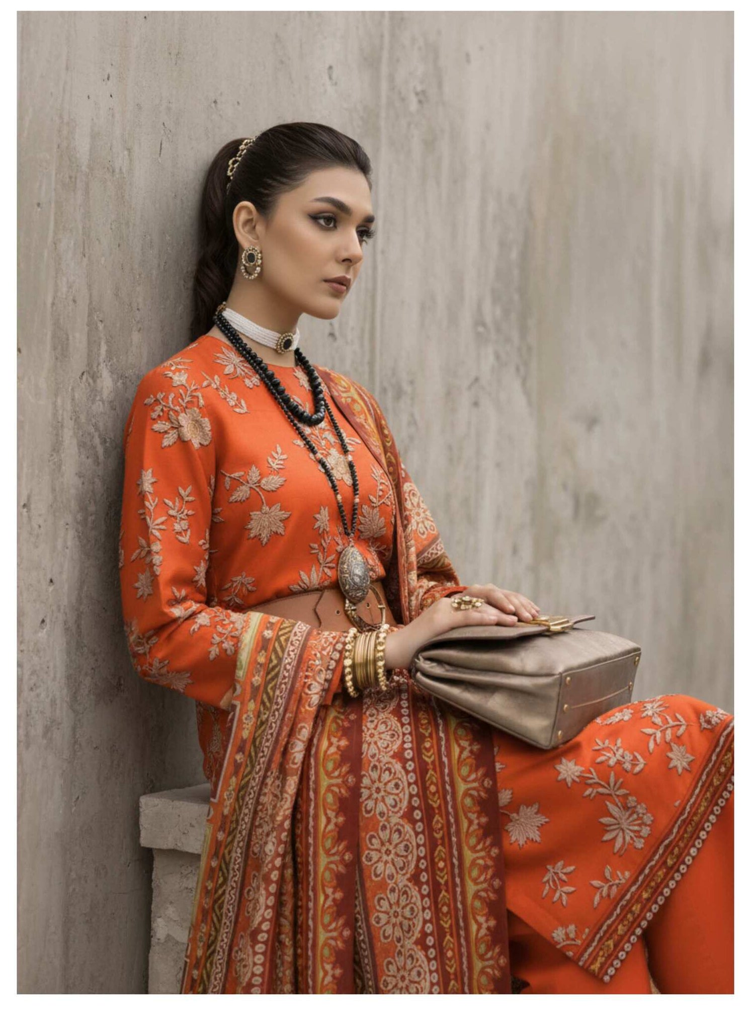 Rust orange embroidered luxury 3-piece suit with printed dupatta, featuring intricate embroidery and vibrant fabric details.